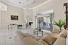 Formal living room with large windows and open feel