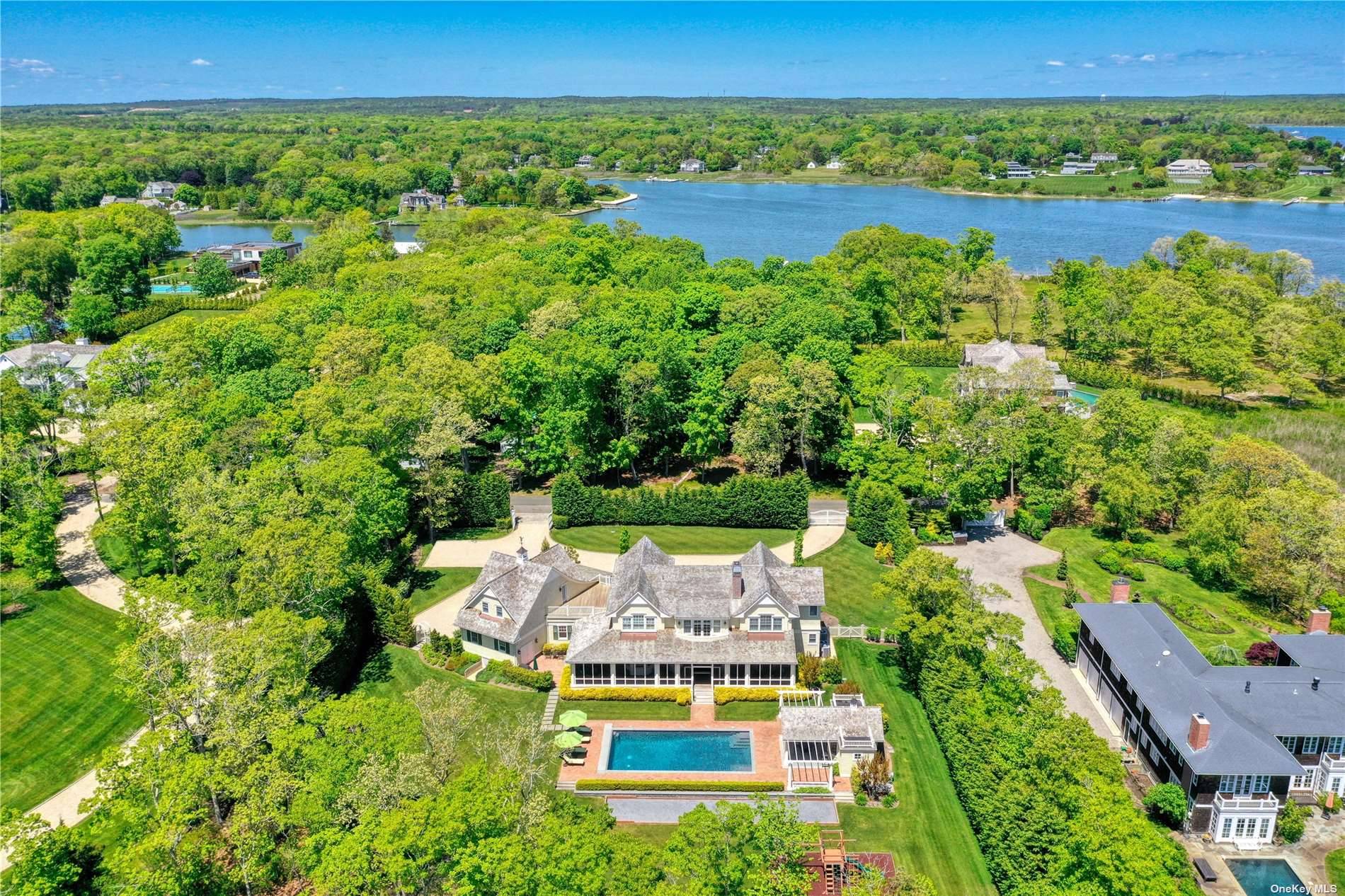 Situated on 2. 8 waterfront acres on prestigious Bay Road in the Village of Quogue, this grand shingled residence offers the ultimate in Hampton's living !