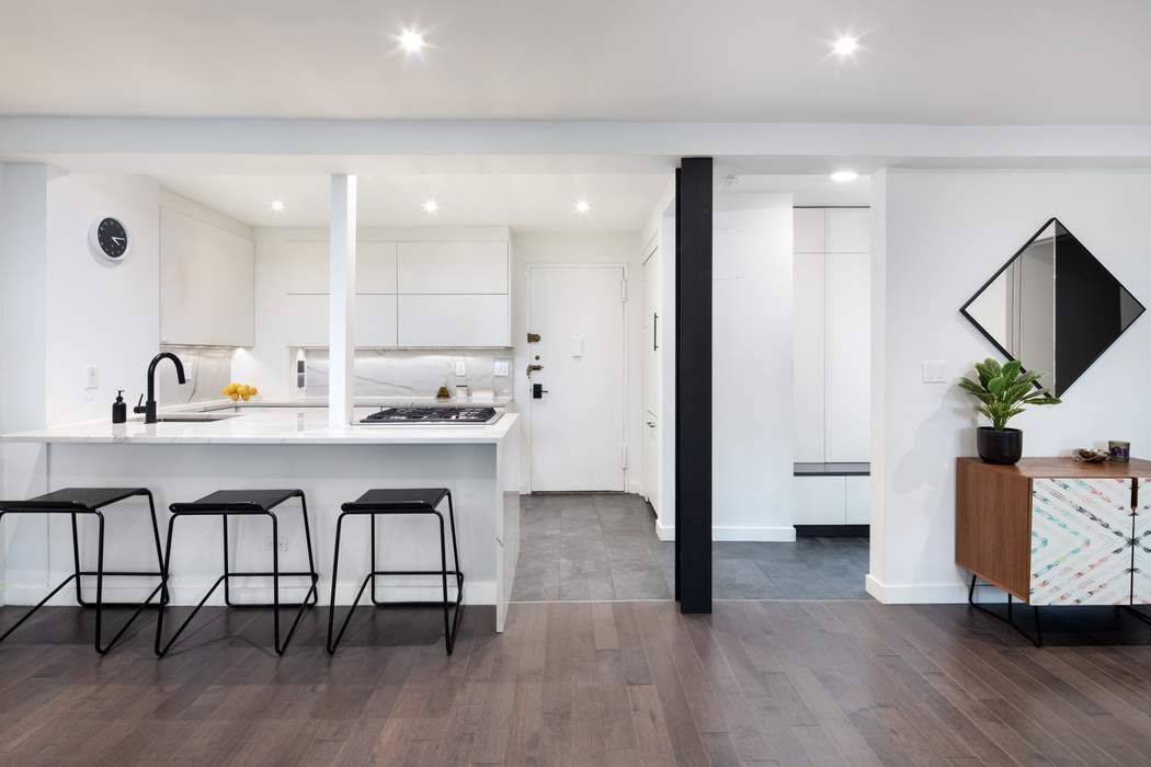 Welcome to this rare and newly renovated third story 3 bed 2 full bath combined unit that seamlessly merges spacious living with urban convenience.