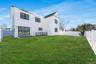 Level backyard space accessible from the main living area, providing room for outdoor enjoyment and entertaining.