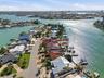 Drone shot looking east on tranquil Bellevue Drive with 4 Bellevue highlighted in "red". Most homes have already been remediated or are in the proces