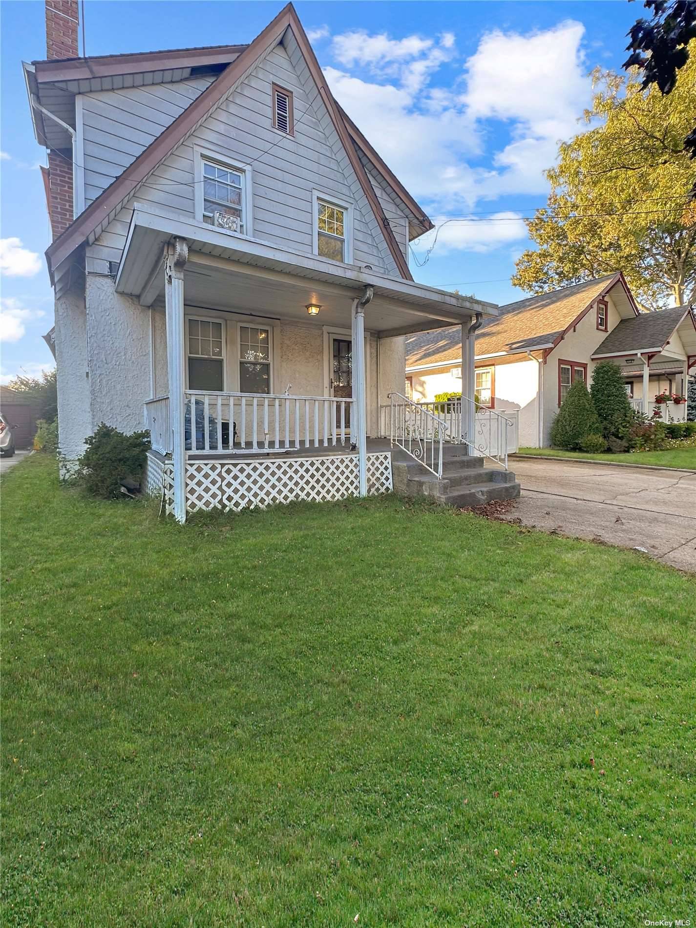 Charming expanded cape in the heart of Floral Park, nestled on a generous 40x100 lot.