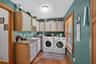 Spacious Laundry Room with Utility Sink & Abundant Cabinet Storage