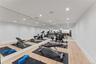 Exercise room featuring recessed lighting and light wood-type flooring
