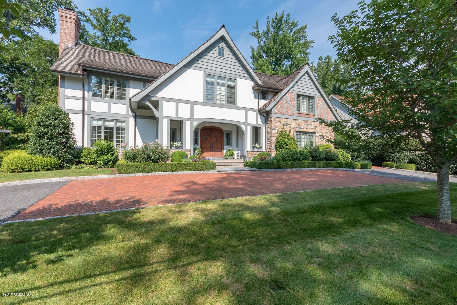 Milbrook Association close to Greenwich Ave train Custom exquisite home on private gorgeous level property allows for amazing indoor outdoor living.
