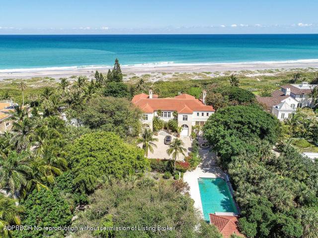 A singular opportunity in the secluded enclave of Jupiter Island, this unique property spans 142' of direct ocean frontage.