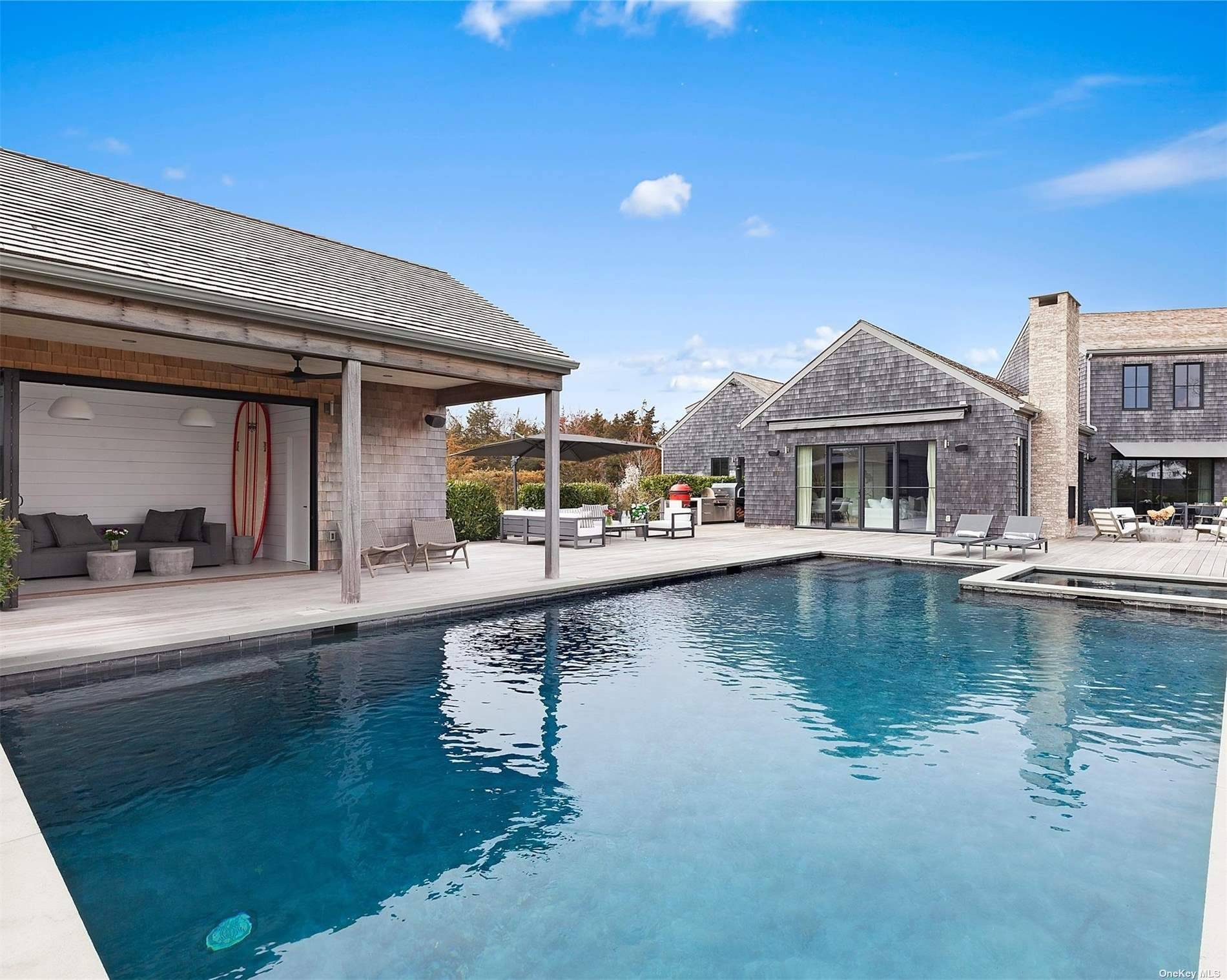 Your Hamptons retreat awaits, a luxurious 6, 580 sq ft modern farmhouse style home on 2.