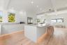 Kitchen featuring modern cabinets, recessed lighting, light wood-style floors, white cabinetry, and beam ceiling