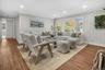 Open and welcoming living area with refinished floors and a seamless flow that’s perfect for gatherings or quiet evenings at home.