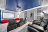 custom designed movie theater with 6 reclining chairs and 120" projector, and sound system.