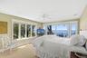 Carpeted bedroom with access to exterior, ceiling fan, and recessed lighting