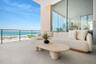 Main floor terrace highlights 40 feet of outdoor living space featuring Longboard™ accents to compliment to azure blue Gulf