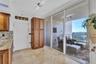 A large pantry with pullout drawers round out the kitchen cabinet tree. All very conveniently located with sliders to the front Terrace.