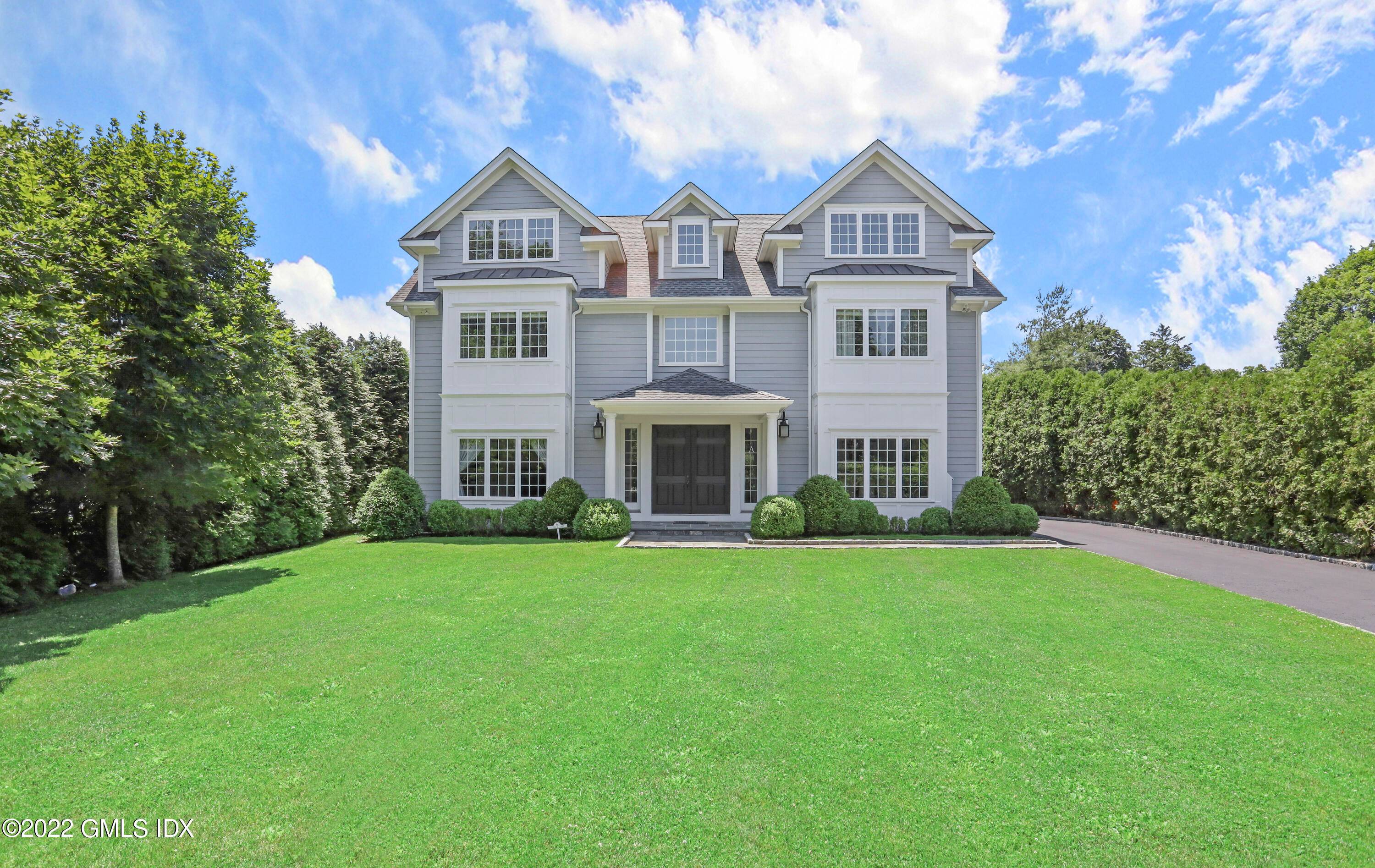 Classic elegance defines this stunning four bedroom Colonial with stone terrace and secluded backyard on.