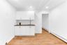 Wet bar with cabinetry on lower level