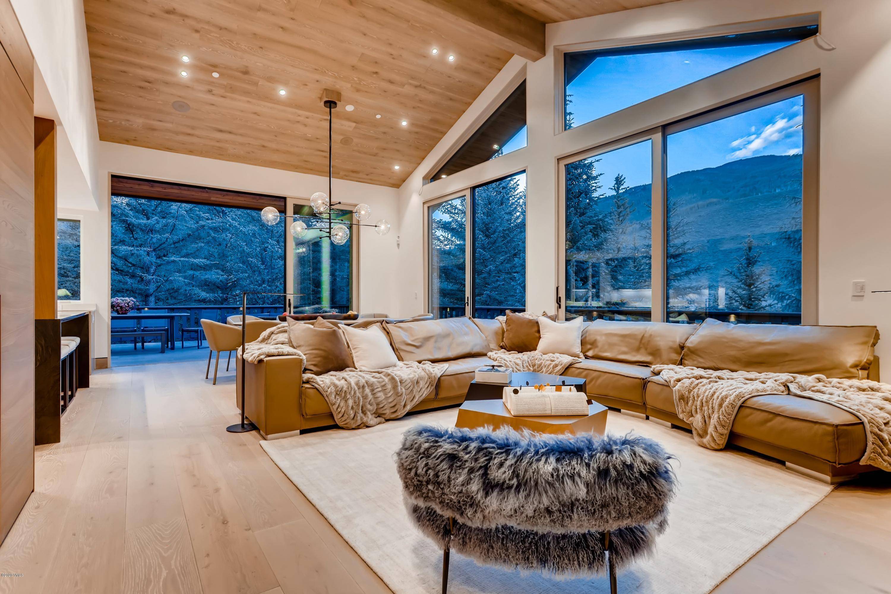 Completely renovated and expanded 355 Forest Road is a contemporary home nestled among the aspens in a private tranquil setting.