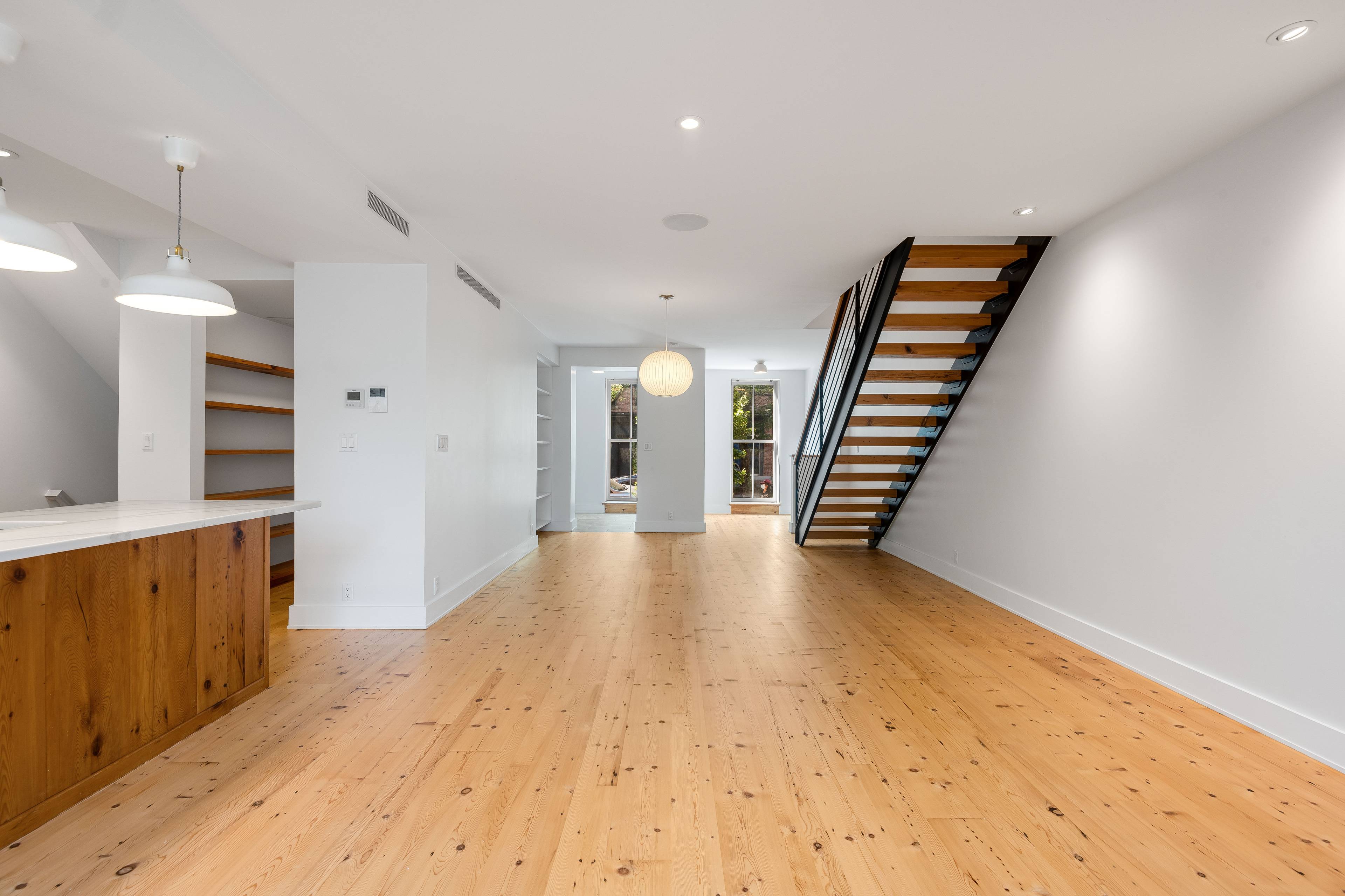 Rarely available, recently constructed magnificent 25 foot wide Georgian period townhouse powered with solar energy in the heart of Red Hook, Brooklyn, on beloved Van Brunt Street.