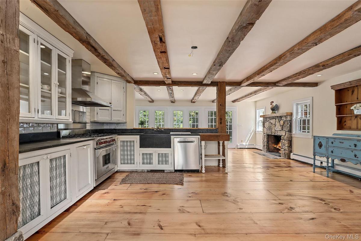 Original wide plank wood floors and beams.