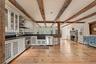 Original wide plank wood floors and beams.