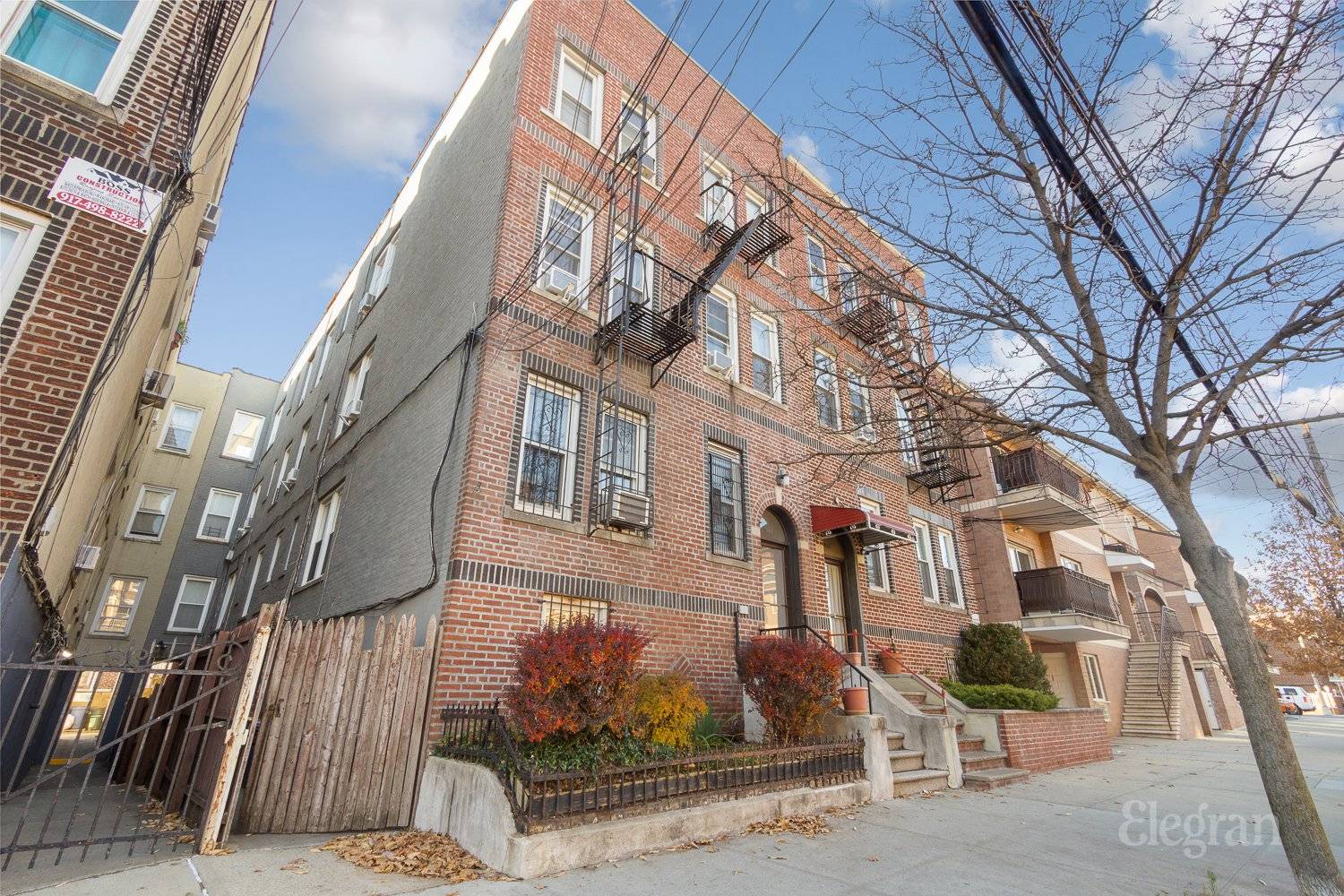 This is a multi family brick townhome located in Pelham Bay.