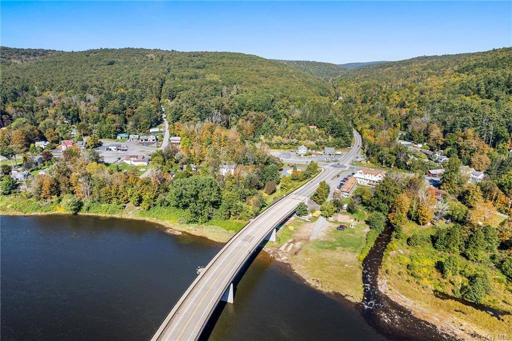 Nestled in the picturesque town of Barryville, New York, this property offers a unique opportunity to own 104 acres of raw land ready for improvements PLUS an adjoining commercial property ...