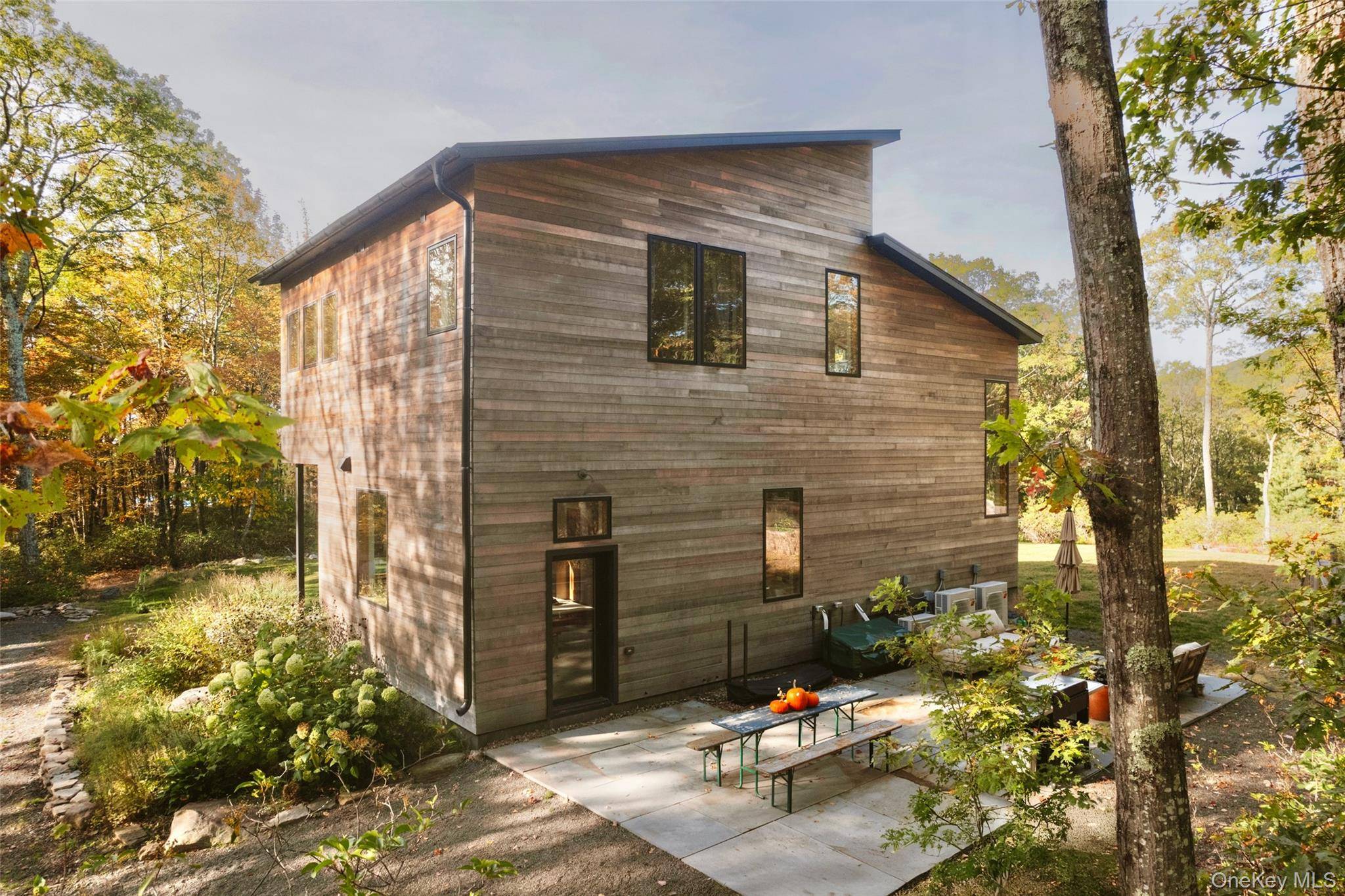 SUMMIT SANCTUARY Discover complete and utter tranquility in this very private jewel of a Modern Weekend Getaway nestled against the Catskill Mountains in highly sought after Kerhonkson.