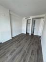 Unfurnished bedroom with dark wood finished floors and a closet