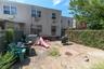 Rear view of property featuring a fenced backyard and a patio