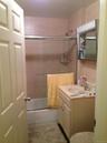 Bathroom with vanity and tub / shower combination