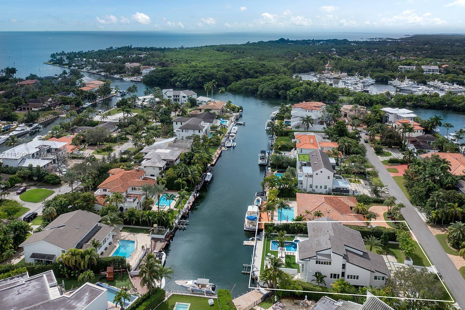 Located within the prestigious and highly sought after gated community of Sunrise Harbor in Coral Gables, with 100 feet of oceanfront and a private dock providing direct access to Biscayne ...
