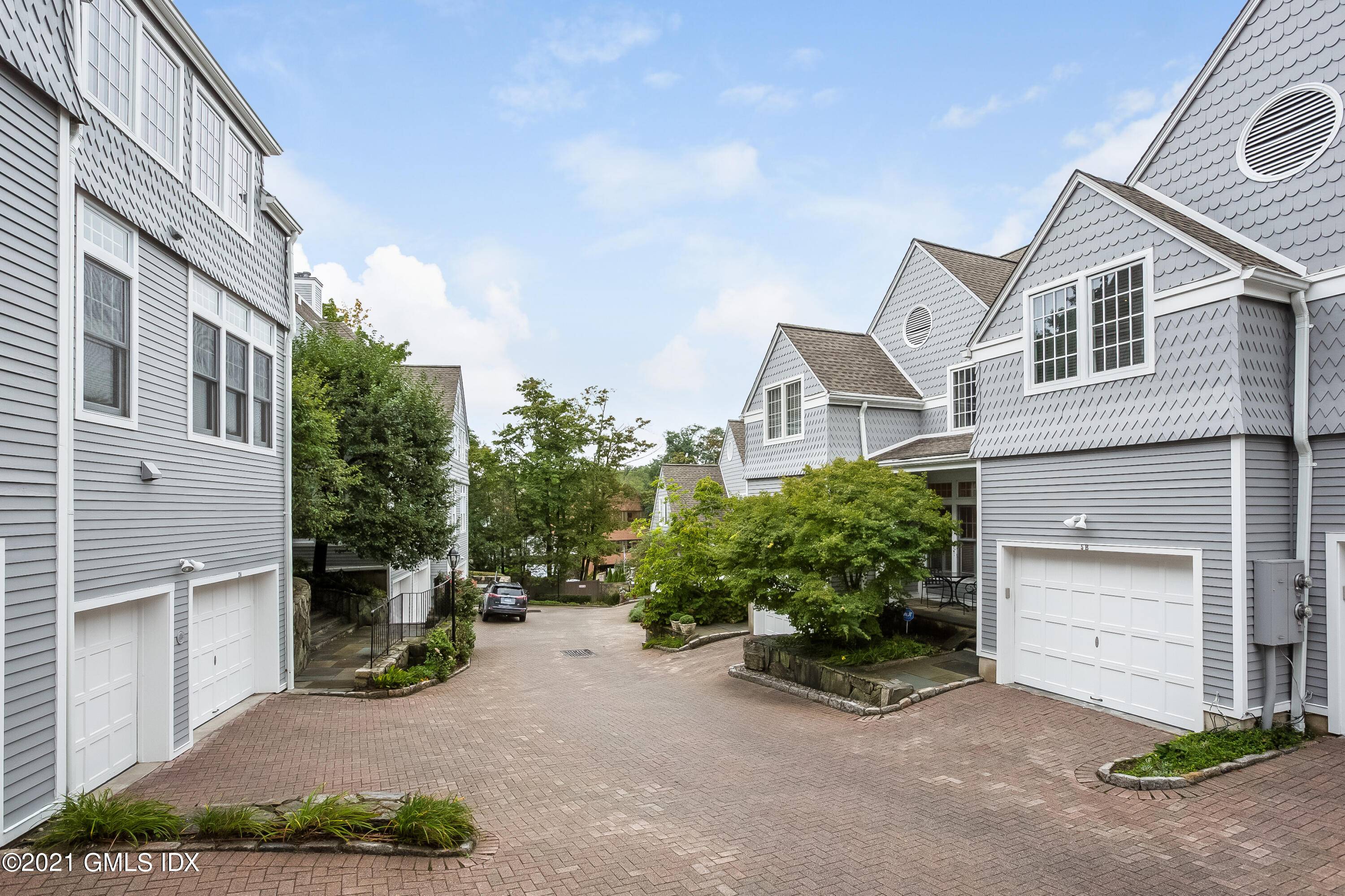 Nestled in a quiet enclave of just 13 homes this gorgeous condo has the feel of a single family home.