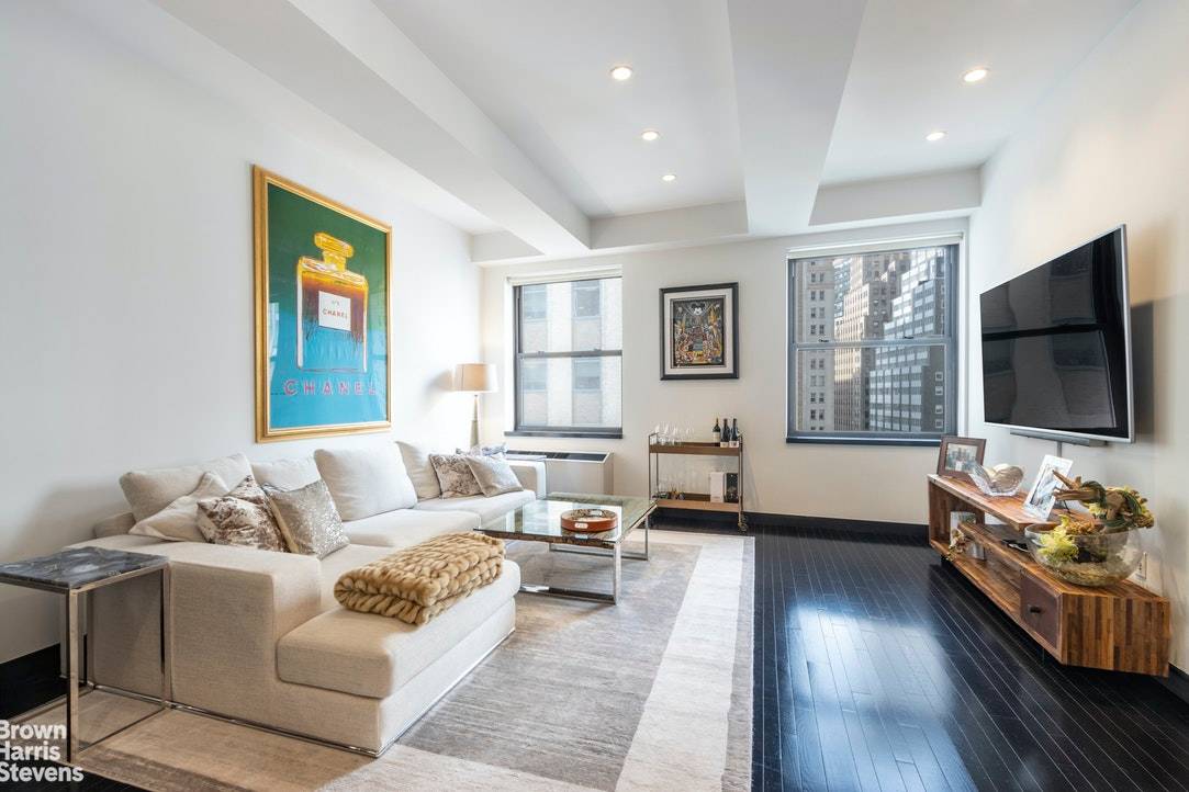 Welcome home to this coveted, south facing, high floor loft at 20 Pine Street.