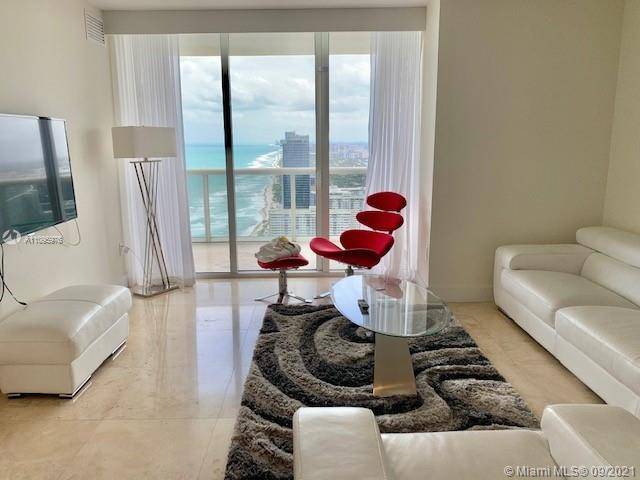 WELCOME TO PARADISE ! ! ENJOY BREATHTAKING VIEWS FROM THIS 49TH FLOOR LOWER PENTHOUSE UNIT.