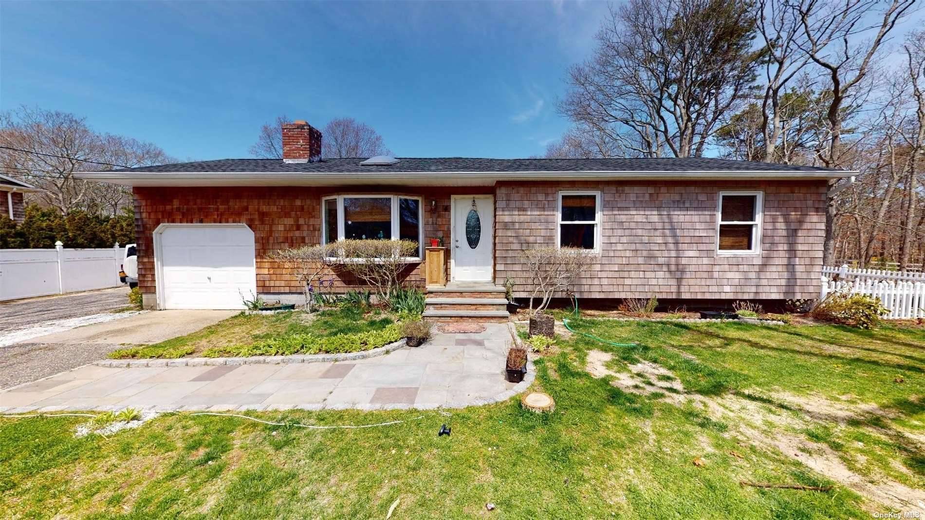 Beautiful ranch house on a large lot in East Quogue with in ground pool.