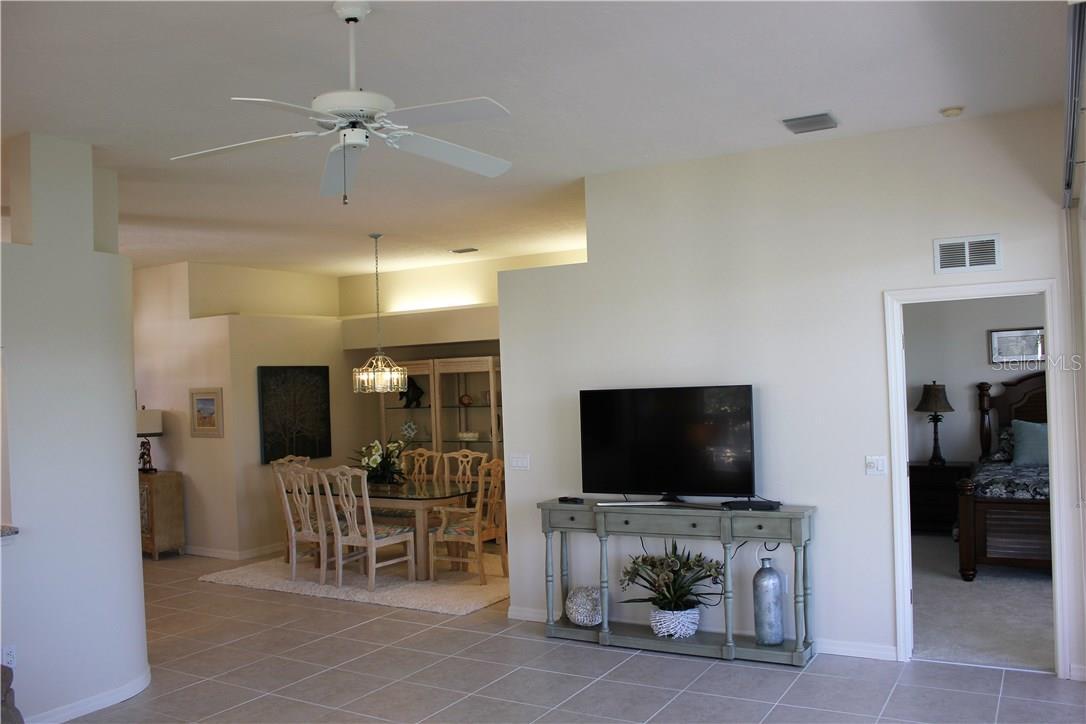 Looking from Main living area toward formal dining table. Master bedroom on the right.....front door/foyer on left of the dining area.