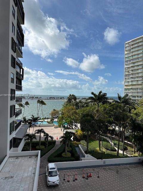 Beautiful 3 bed 2 bath Storage, the third room is a den converted into a room, Brickell waterfront condo with wrap around balcony, with Biscayne Bay Water Views.