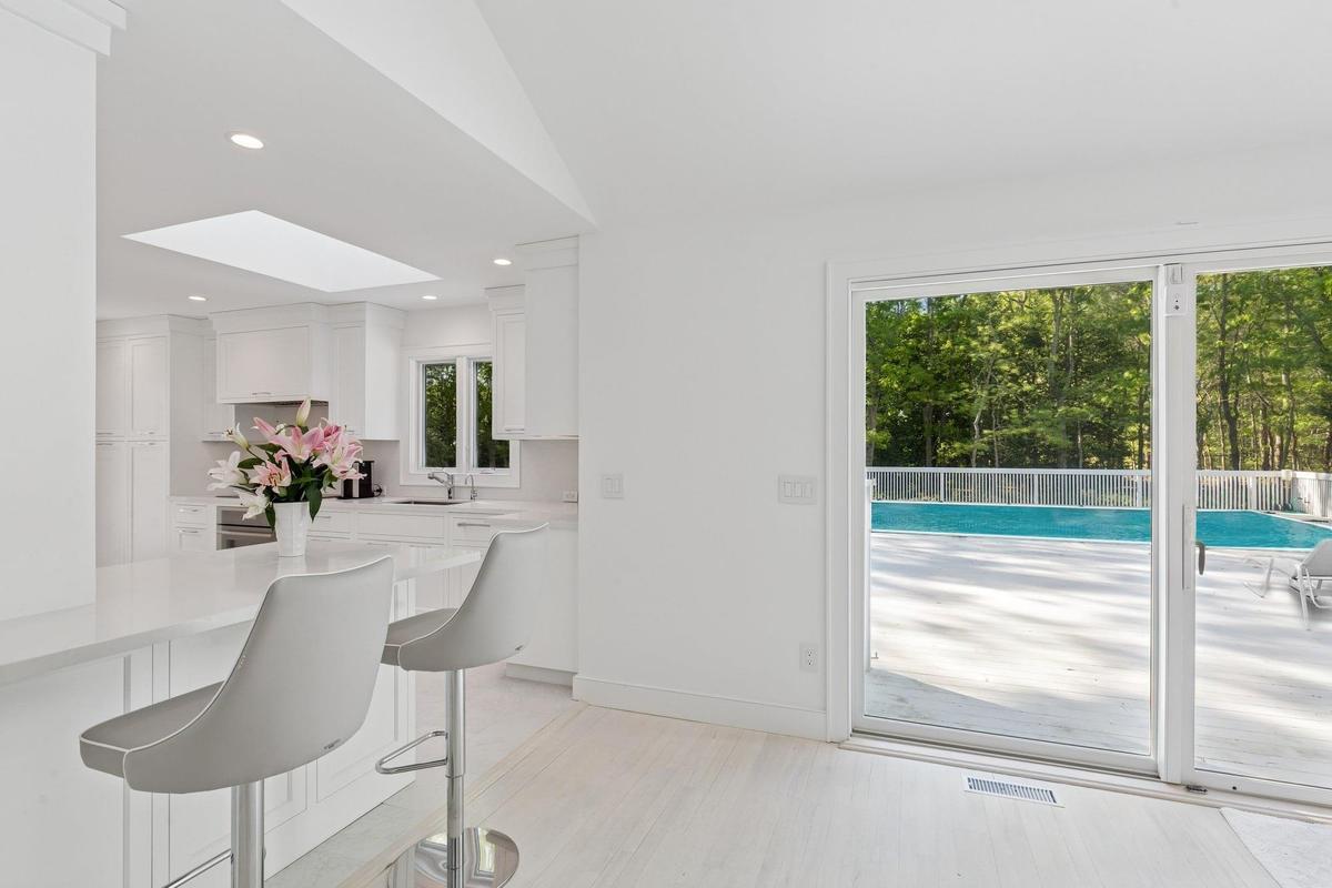 Dining area featuring a skylight and recessed lighting