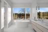 Bathroom with a bathing tub and vanity