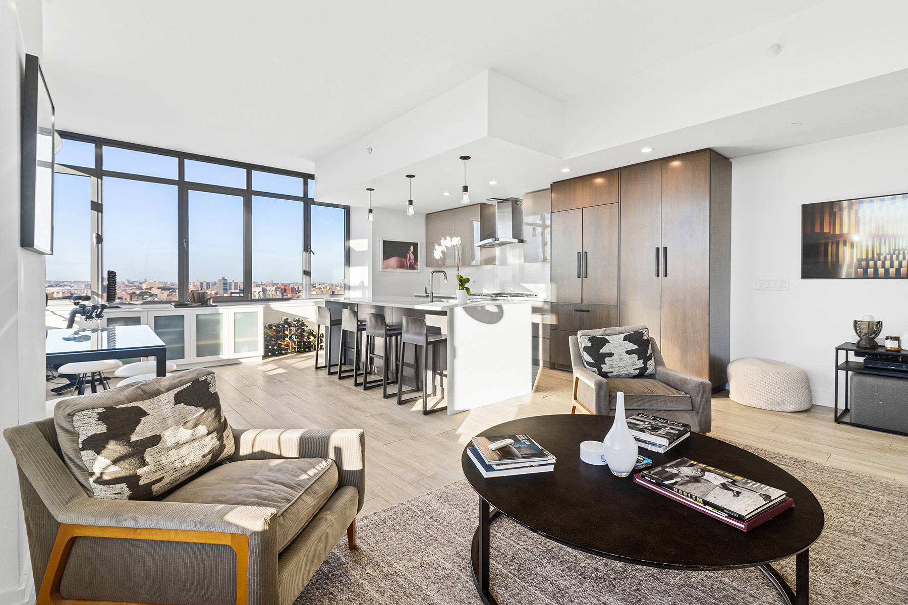 Perched high above the corner of Fifth Avenue and South Harlem's Marcus Garvey Park, residence 25F is where downtown loft chic meets New York's most iconic address.