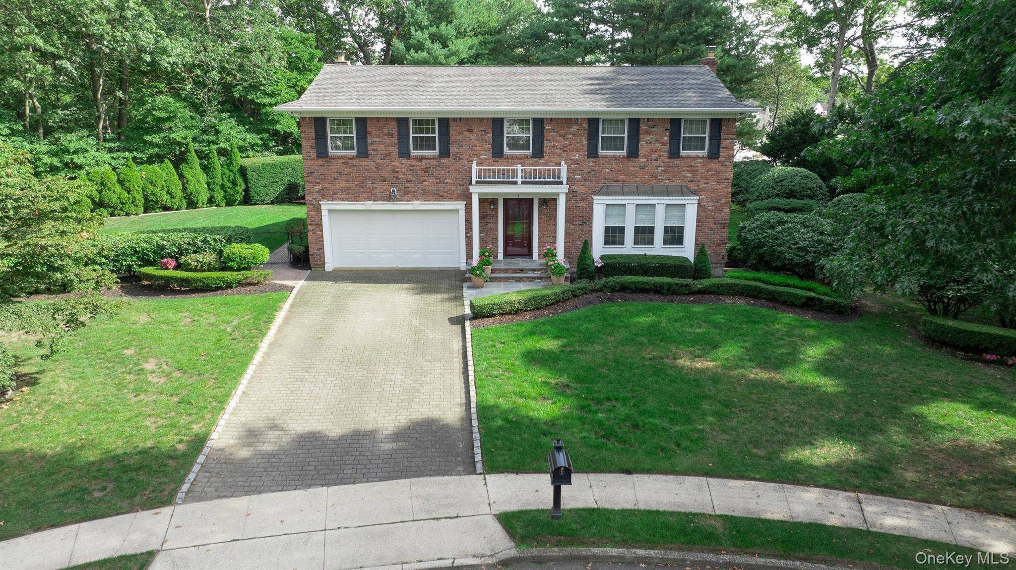 Move right into this elegant and beautifully remodeled Brookfield colonial, privately set on.