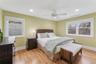 Bedroom featuring light wood-type flooring, multiple windows, ceiling fan, and recessed lighting