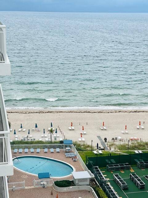 Embrace endless Oceanfront luxury in this sw corner high rise !