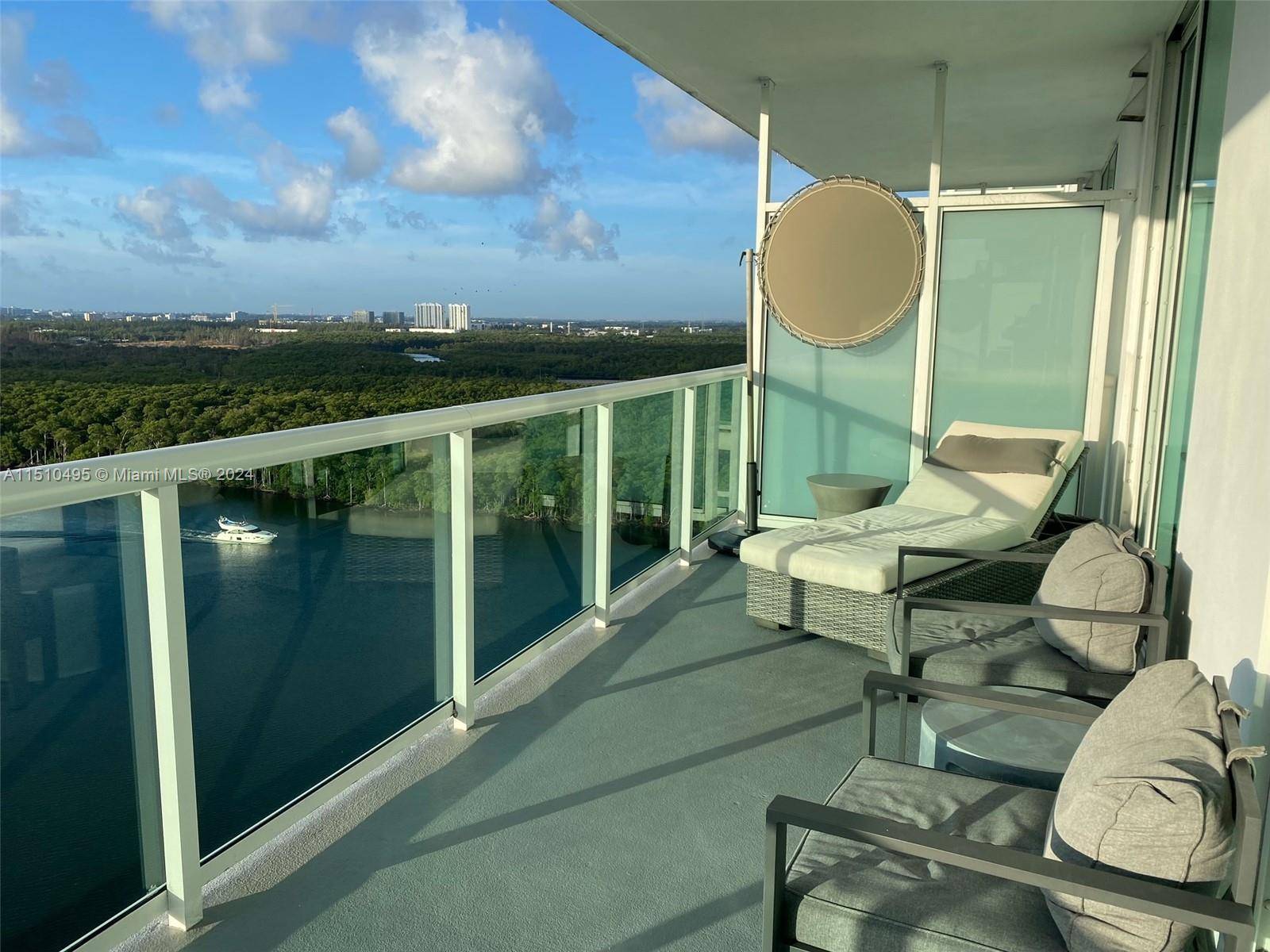 Experience waterfront luxury in this stunning 3 bedroom, 3 bathroom unit, offering awe inspiring views of the bay, ocean, and Oleta State Park.