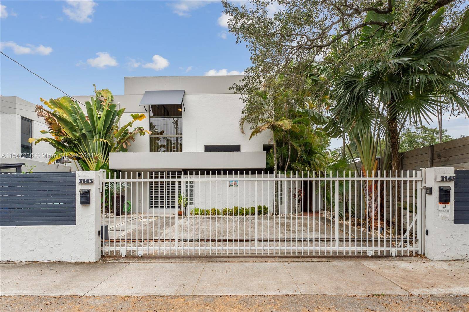 Welcome to Paradise ! A lush garden entrance sets the special ambiance for this spectacular furnished corner townhome with extra large private tropical garden bricked patio.