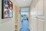 Closet lined hall to Primary Bedroom