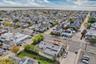 Aerial view of property's location featuring nearby suburban area