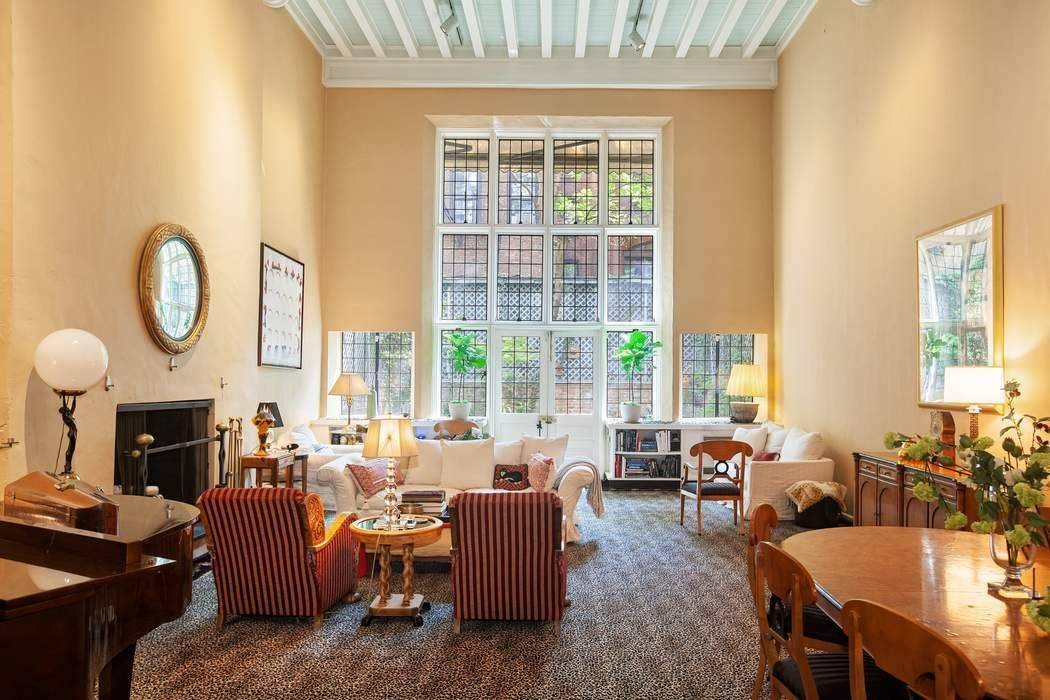 A magnificent 23. 5 foot wide townhouse featuring a living room with a 20 foot high ceiling built by the legendary Rosario Candela as part of a 1919 Sterner and ...