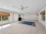 This downstairs covered area is behind the left garage bay on off the courtyard and is nonconforming but makes a great space for ping pong or yoga ove