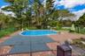 In-Ground Pool within designated Fenced in area. *Pool water edited with AI*