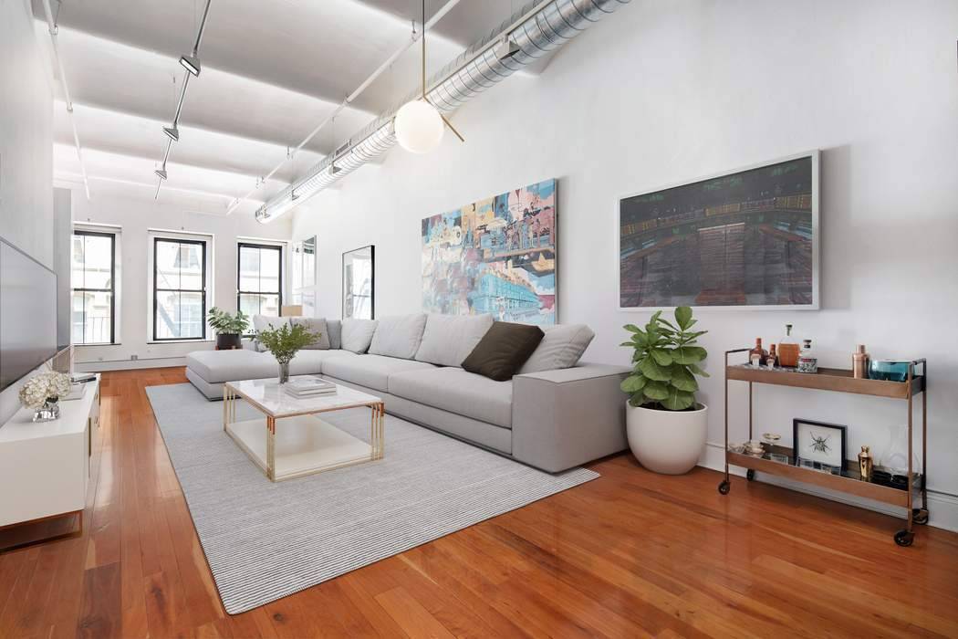 114 Mercer 2 is a sprawling 2, 300 square foot loft with the tallest ceiling heights in the building over 12 ft !